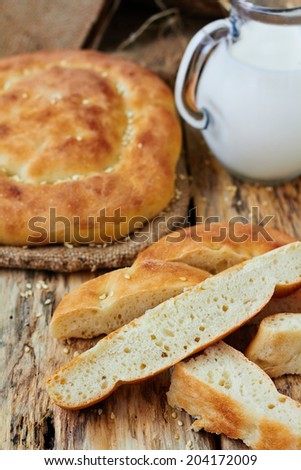 Homemade flat bread with sesame and milk