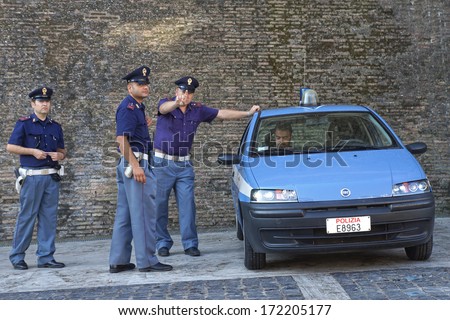 ROME-ITALY, AUGUST 28, Italian police on duty at the walls of the Vatican in Rome August 28, 2013. Servant of the law expresses dissatisfaction with the photo session