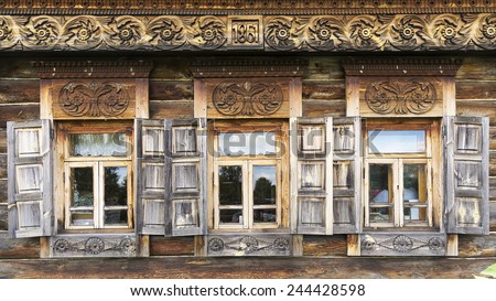 facade of an old wooden house with openwork carved architraves in Suzdal (Golden Ring of Russia)