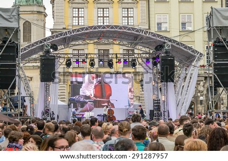 Lviv, Ukraine - June 2015: Alfa Jazz Fest 2015. Musician bands Contrast Trio perform before the audience fans on stage jazz festival on the Market Square in Lviv near the town hall