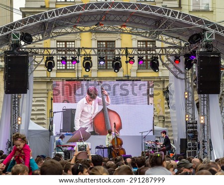 Lviv, Ukraine - June 2015: Alfa Jazz Fest 2015. Musician bands Contrast Trio perform before the audience fans on stage jazz festival on the Market Square in Lviv near the town hall