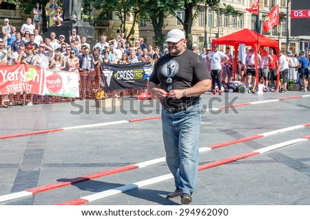 Lviv, Ukraine - July 2015: Yarych street Fest 2015. The World\'s Strongest Man Vasyl Virastuk referee strongmen competitions