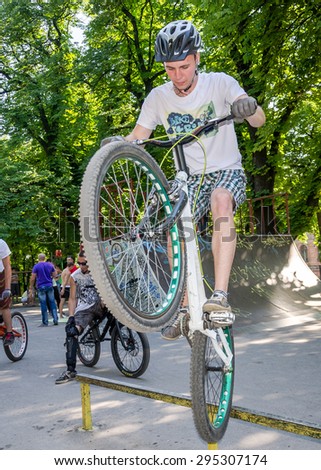 Lviv, Ukraine - July 2015: Yarych street Fest 2015. Extreme jumping on a BMX bike and perform stunts in the air