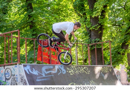 Lviv, Ukraine - July 2015: Yarych street Fest 2015. Extreme jumping on a BMX bike and perform stunts in the air
