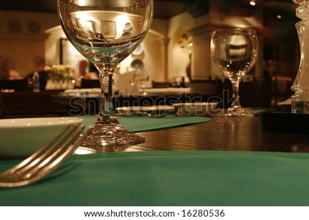 a romantic restaurant with fork and glasses