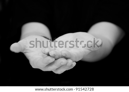 a man gives his hands in asking for help or beg for charity or blessing,  hand palms in black and white