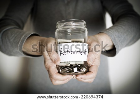 Senior Woman Holding Retirement Jar