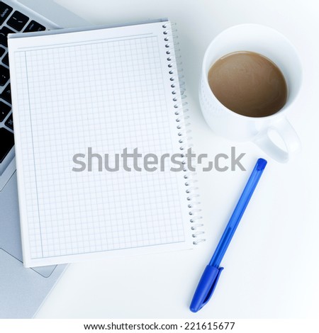 Empty White Sheet on laptop with coffee in office environment, ready for your text