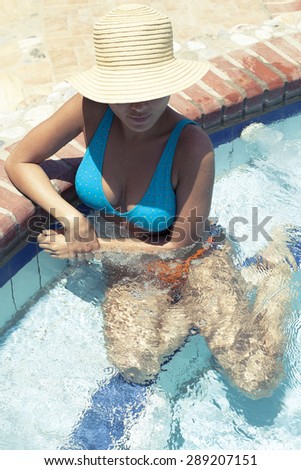 Beautiful Female Relaxing in Jacuzzi Pool Hot Tub Bath in Holiday