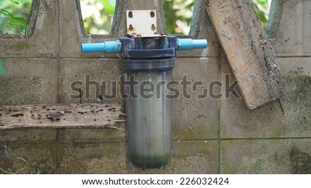 Damaged old water purifier with concrete
