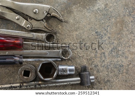 tool renovation on grunge cement background