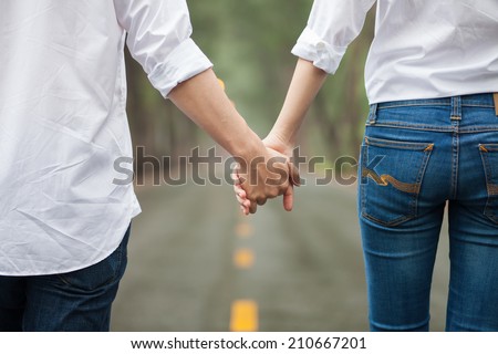 We are walking together by love, hold my hand