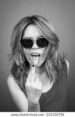 black and white picture of bad girl showing middle finger