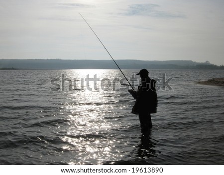fishing on background of water the fish man