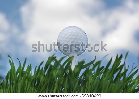 the golf ball on background of sky from clouds