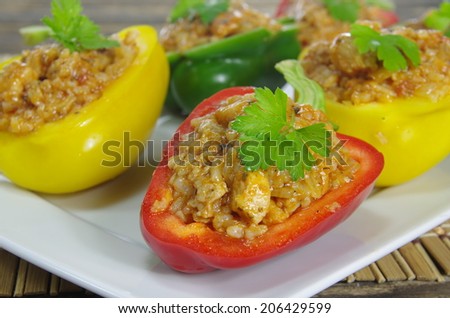 stuffed red green and yellow paprika with meat and vegetables
