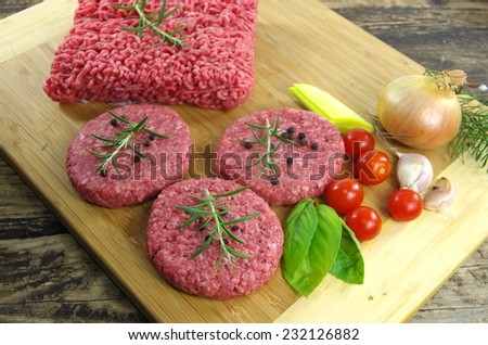 raw minced beef meat with onion and tomatoes