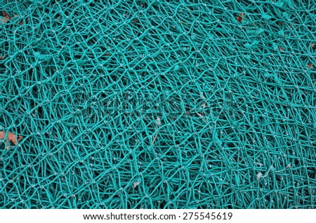 blue fishing net with knots
