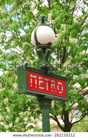 PARIS - MAY 11, 2013: A sign at a subway station entrance in Paris. Paris metro is 214 kilometers long and has 303 stations.