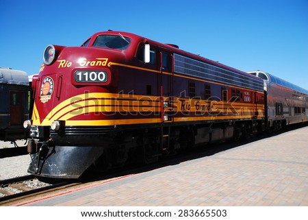 ALAMOSA, CO, USA - JUNE 6, 2013: A diesel-powered locomotive waits for departure at Alamosa station. This scenic train rides to Monte Vista from June to August.