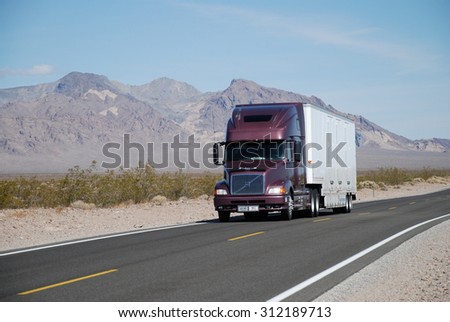 NEAR SHOSHONE, CA, USA - APRIL 21, 2007: a truck drives on Route 127. Trucks carry nearly 70 percent of all freight transported annually in the U.S.