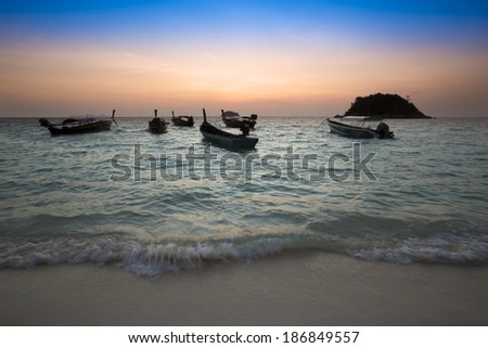 sunrise on beautiful beach. tropical sea in thailand. fishing boat.