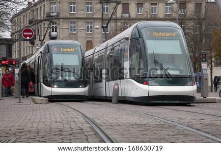 STRASBOURG, FRANCE - NOVEMBER 23: Two modern trams staying on the tram stop \