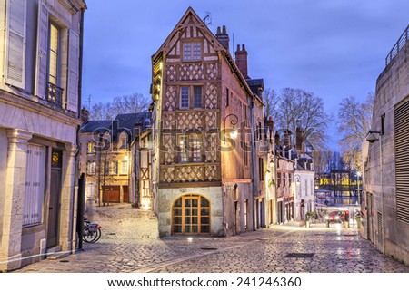 Street, paved with stone blocks and half-timbered house in the center of Orleans, France