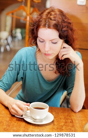Young Redhead Woman Enjoying A Cup Of Coffee Blank Expression