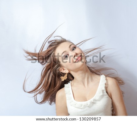 Pretty girl with great fly-away hair. Over white background
