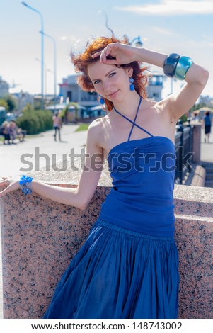 redhead women outdoors  in blue dress