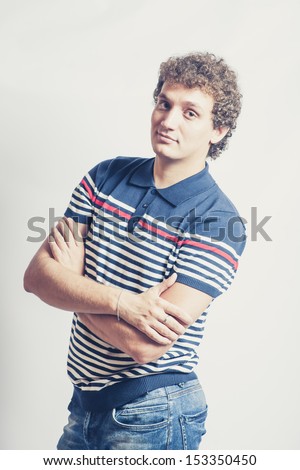 curly man in polo style casual shot in studio toned image