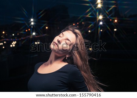 20s lonely woman head and shoulders shot closed eyes  in the old house against city night light.