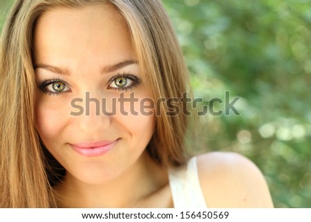 long haired women outdoors enjoy summer, closeup of the face, headshot, smiling