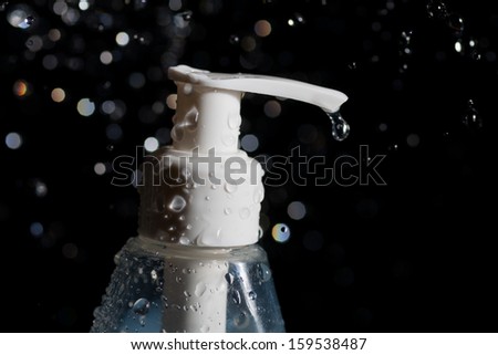 spa  tubes and water drops levitating in the air on the dark background