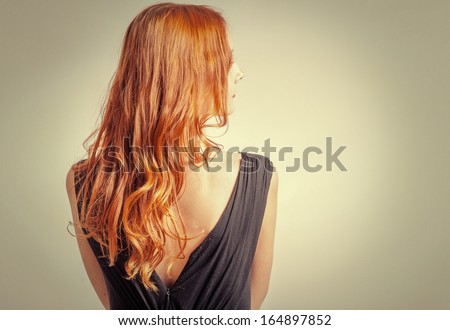 Back View Of Red Curly Long Hair Of Beautiful Woman With A Lot Of Copyspace