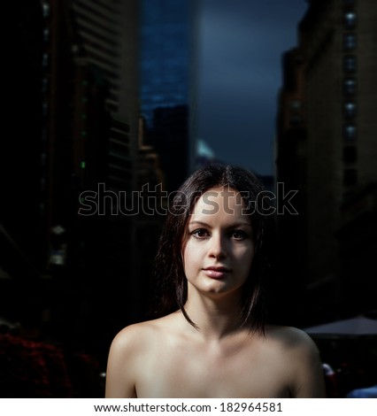Dark metropolis dreams. Nude women alone in a street