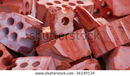 heap of red broken bricks