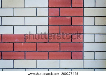 Brick wall background. Red and white bricks,  a lot of copyspace. Wall of a modern building as backdrop