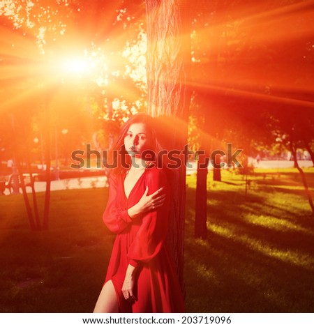 Fairy tale. Women in retro dress at sunset in a forest backlit image