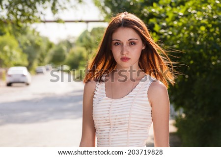 Beautiful Young Woman Enjoying Sunset in Calm State of Mind