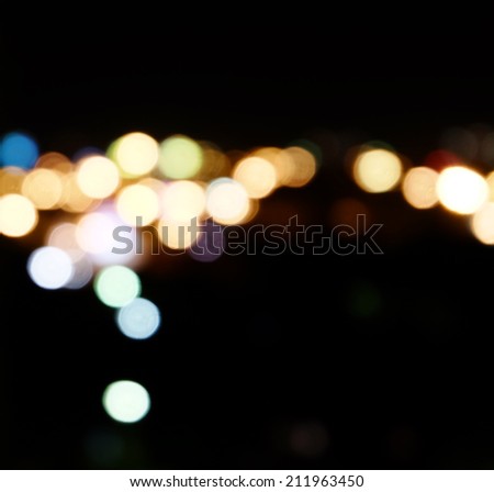 City lights in the background with blurring spots of  light a lot of copyspace.