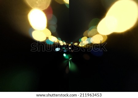 Traffic lights in the background with blurring spots of  light, copyspace