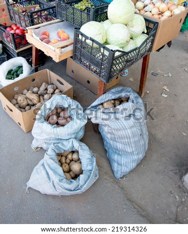 Potatoes in bags, fruit and vegetables stall in Russia.