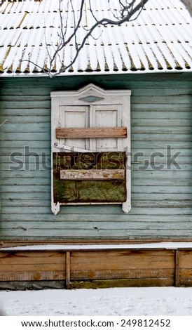 Immured Old wooden window in a wall. Old woody window of ruined house Astrakhan, Russia.