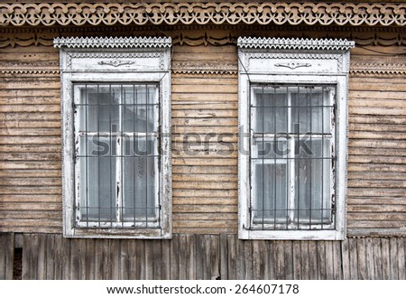 Two ancient russian style wooden windows in Astrakhan Russia