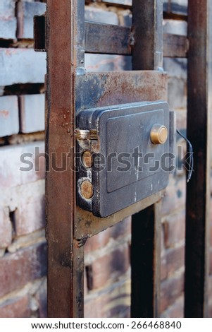 Industrial metal door lock open state. Security access to the secret area.