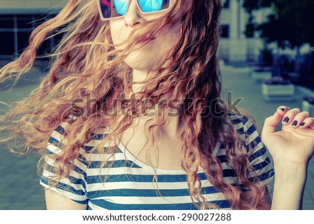 Happy redhead women shaking her head. Summertime fun and happyness