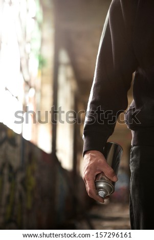 Young man hand detail ready to do a Graffiti
