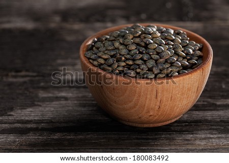 Close-up of French Lentils Sprouting Seeds in a Wooden bowl